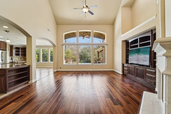 an empty room with a view of a livingroom
