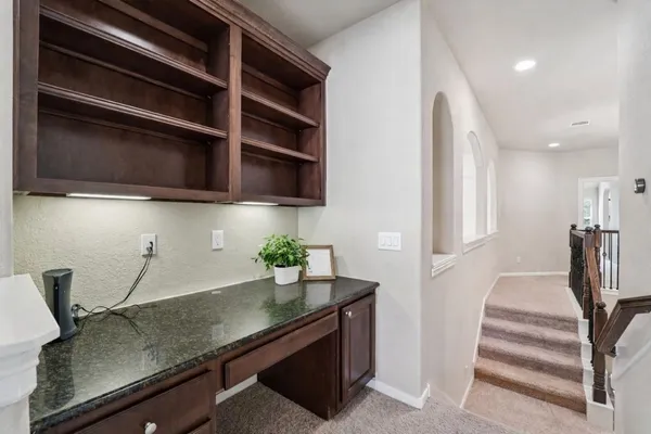 a utility room with sink dryer and washer