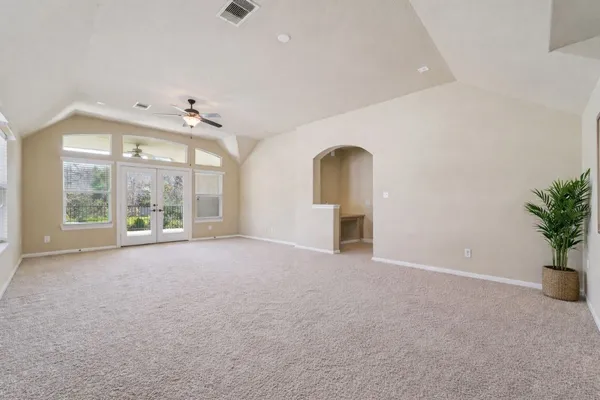 a bathroom with a toilet a sink and a mirror
