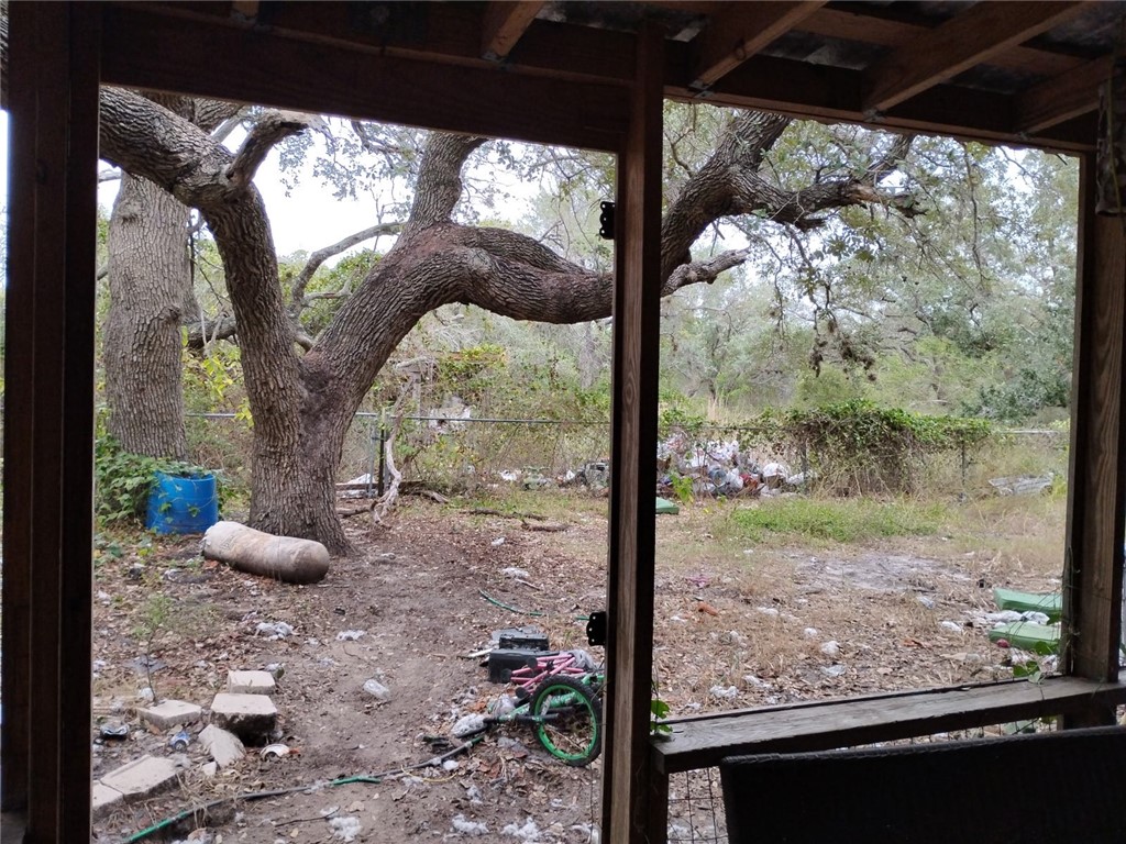 1980 Jocelyn Road Aransas Pass, TX 78336 - Photo 14 of 14 a view of a porch with furniture and floor to ceiling window