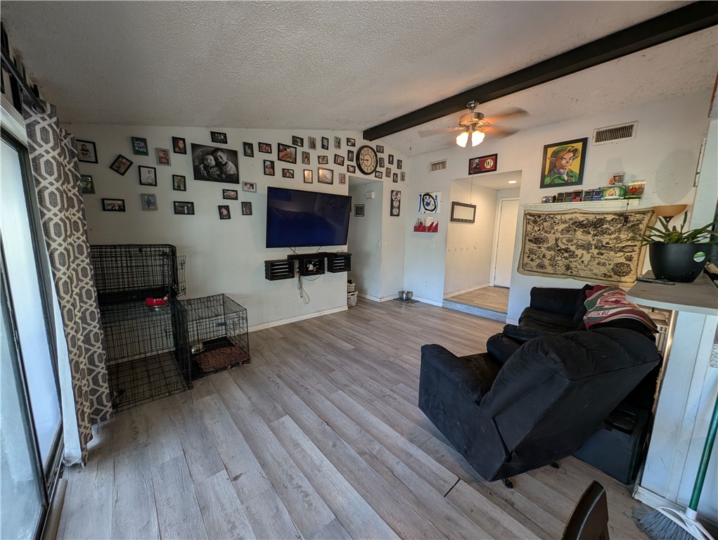 1980 Jocelyn Road Aransas Pass, TX 78336 - Photo 2 of 14 a living room with furniture and a flat screen tv