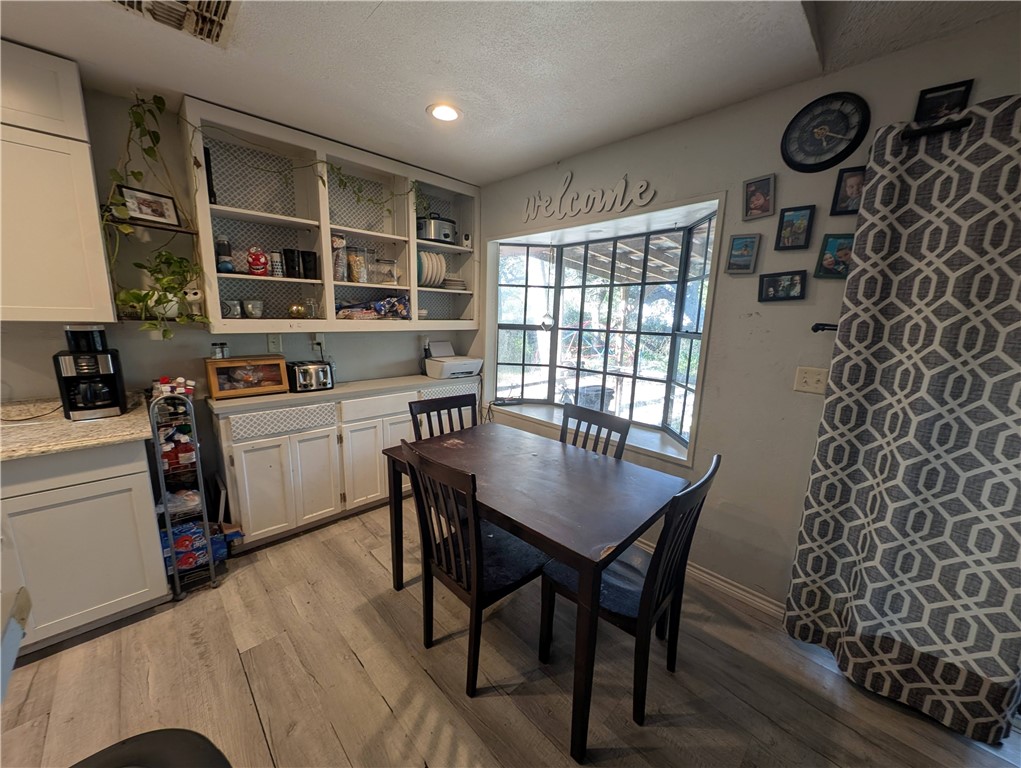 1980 Jocelyn Road Aransas Pass, TX 78336 - Photo 6 of 14 a view of a dining room with furniture and window