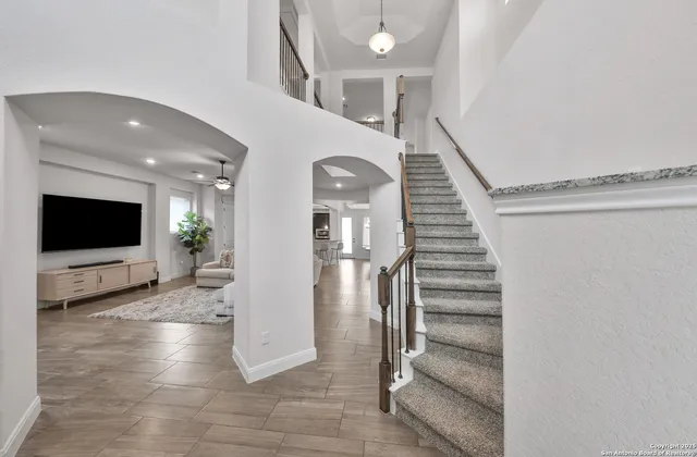 a view of entryway and hall with wooden floor