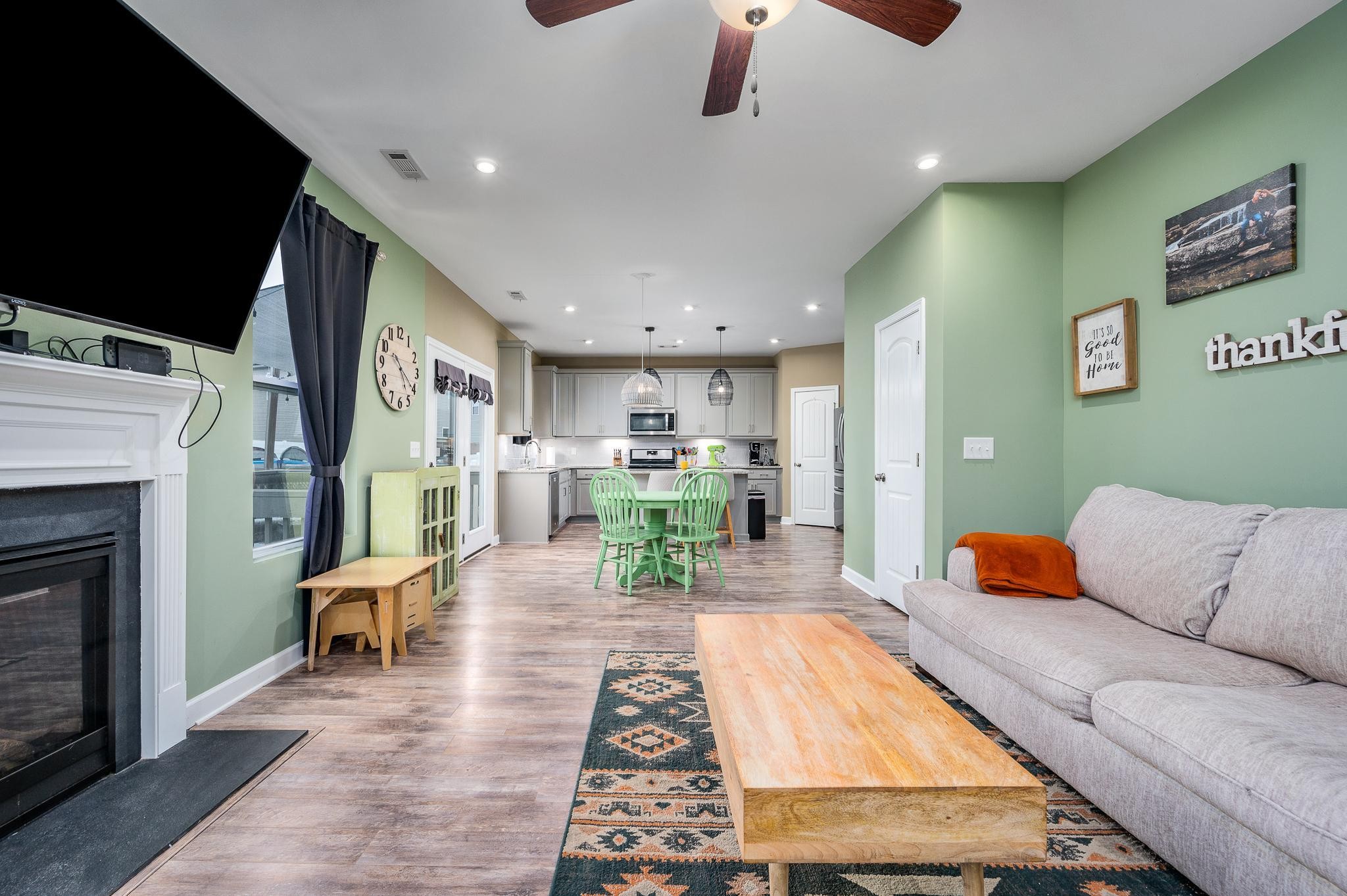 323 Disley Way Murfreesboro, TN 37128 - Photo 19 of 43 a living room with furniture kitchen view and a fireplace