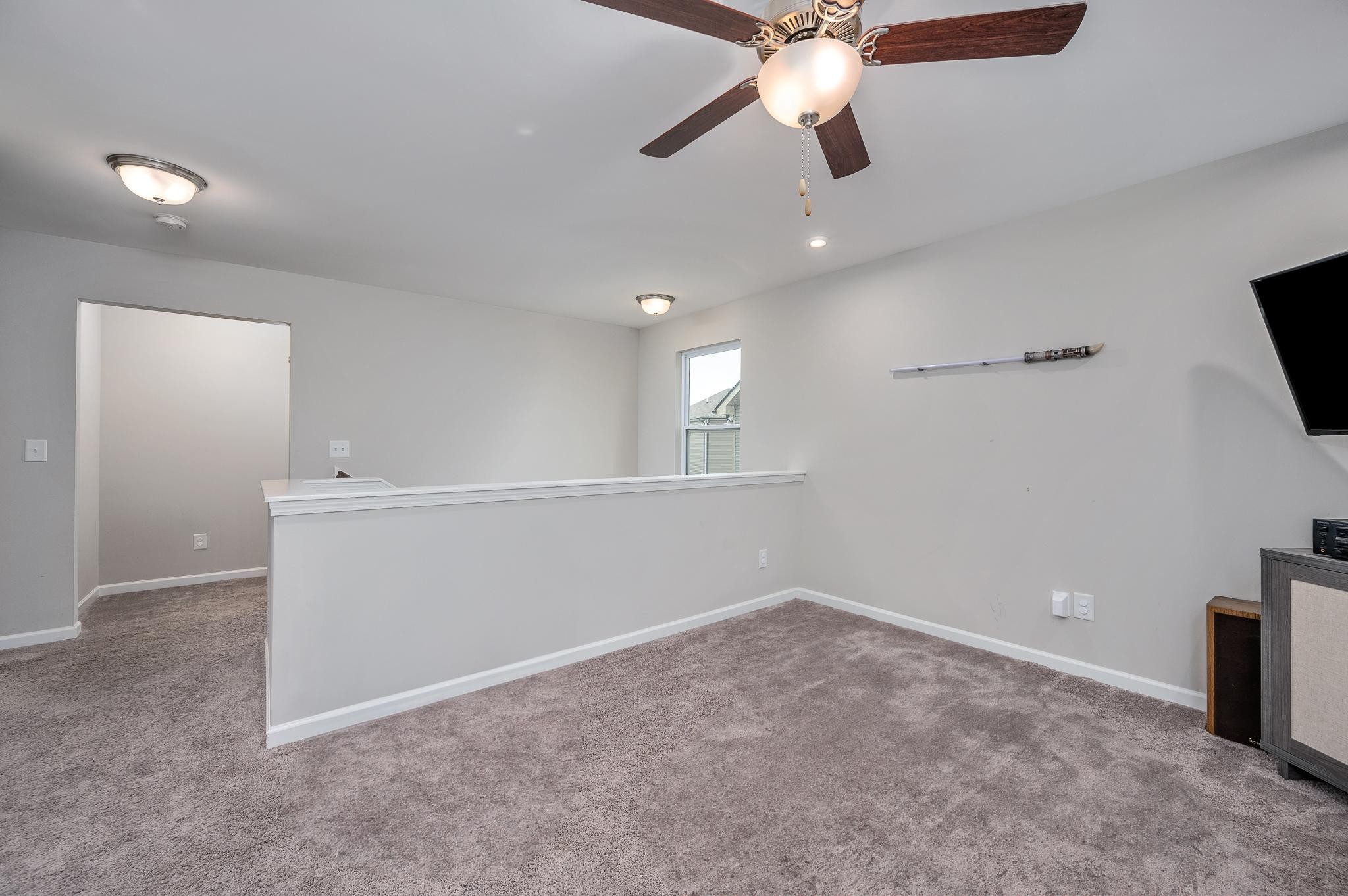 323 Disley Way Murfreesboro, TN 37128 - Photo 21 of 43 an empty room with ceiling fan and window