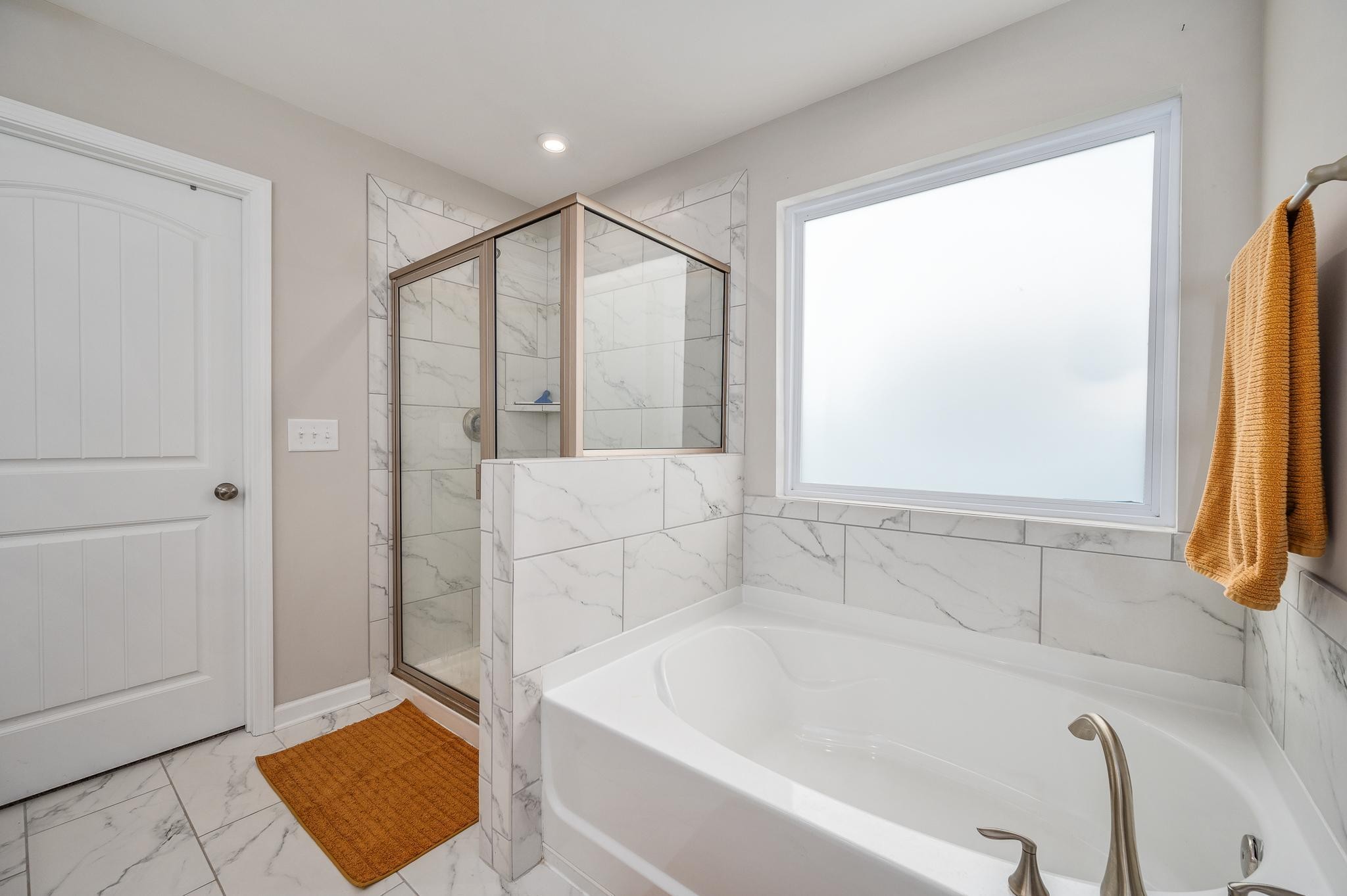 323 Disley Way Murfreesboro, TN 37128 - Photo 26 of 43 a bathroom with a bathtub and a shower