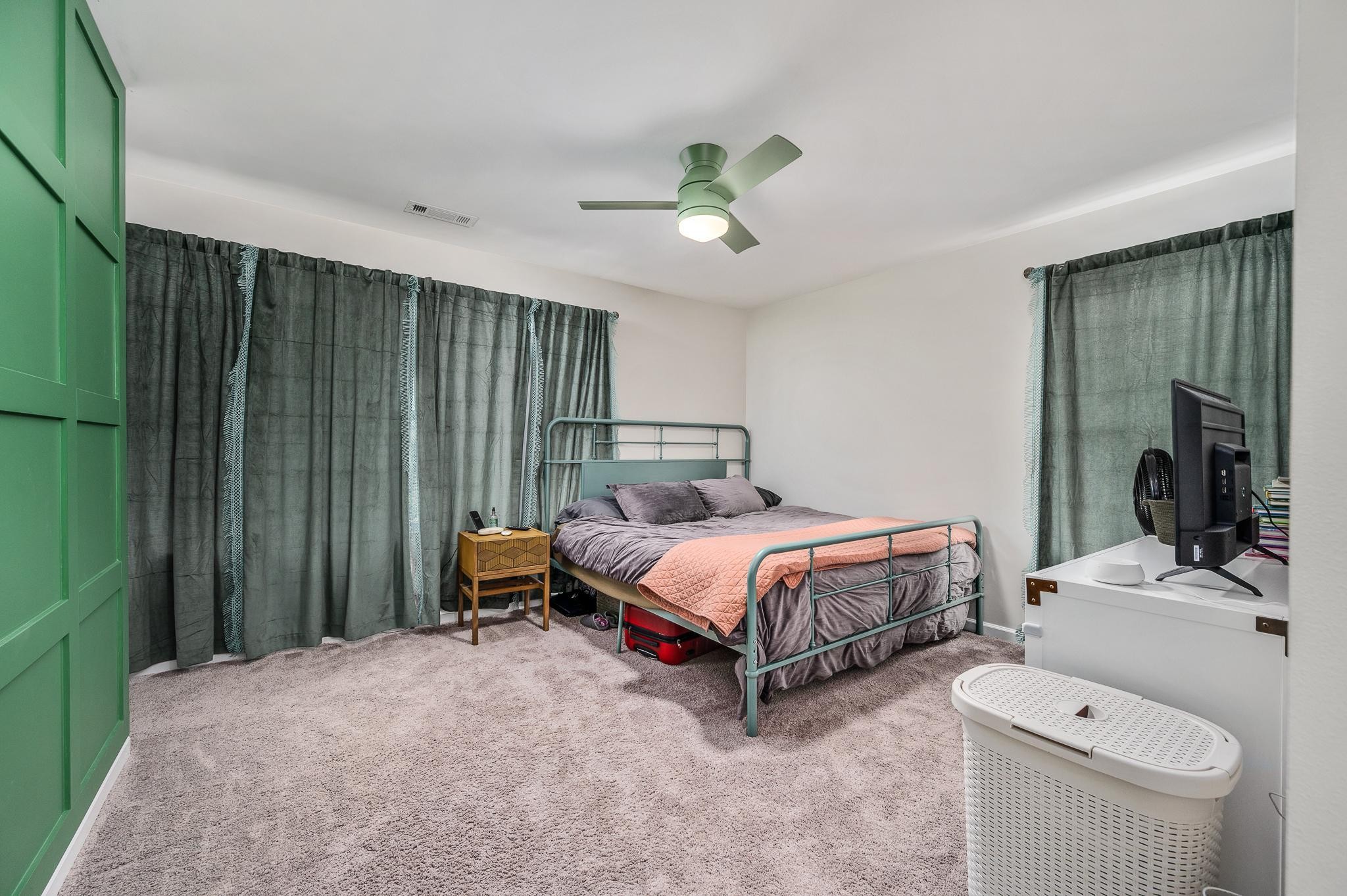 323 Disley Way Murfreesboro, TN 37128 - Photo 31 of 43 a spacious bedroom with a bed and a chandelier