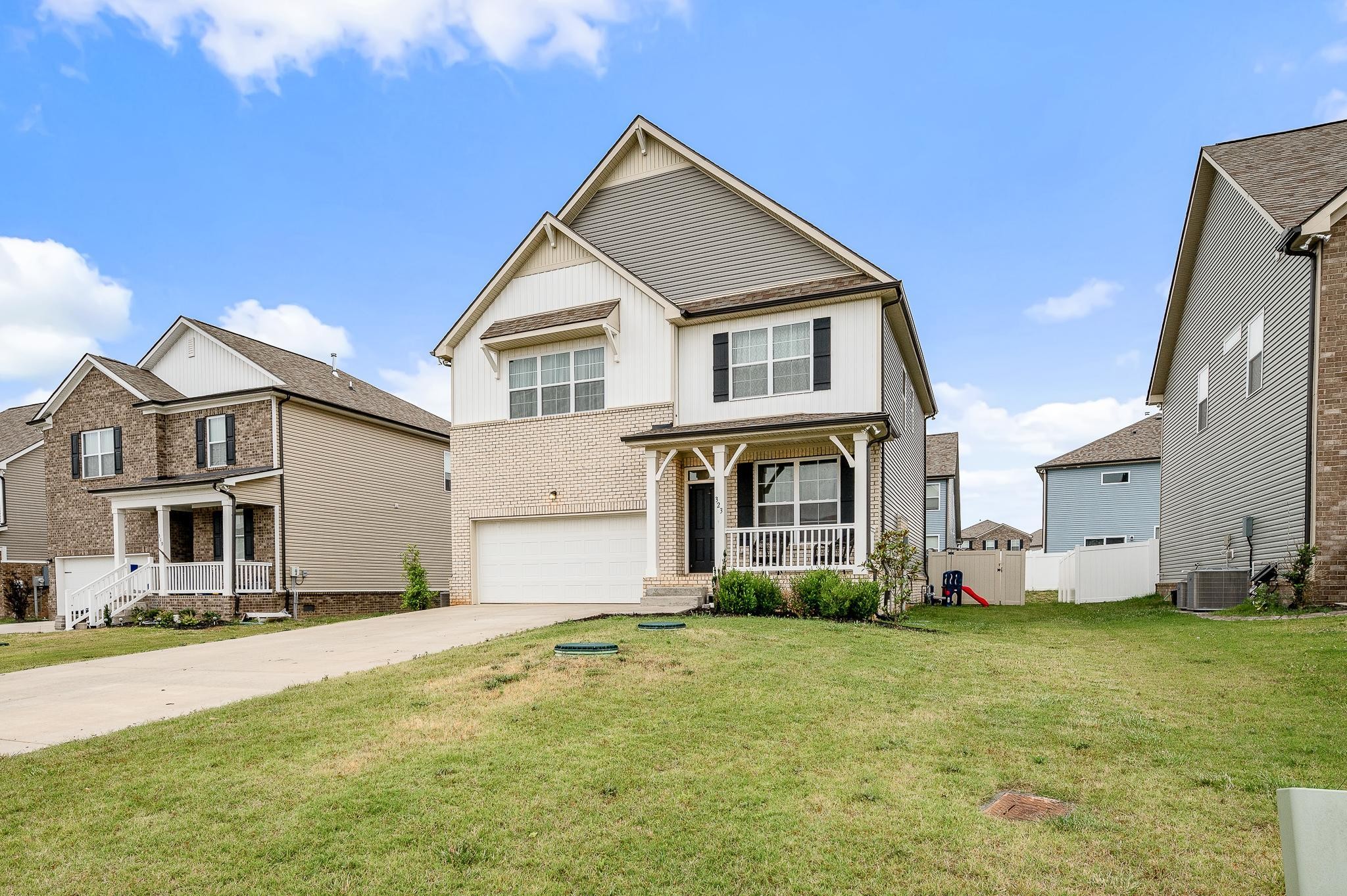 323 Disley Way Murfreesboro, TN 37128 - Photo 7 of 43 a front view of a house with a yard