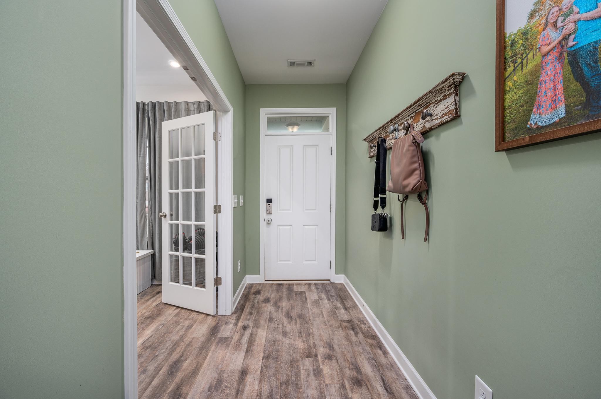 323 Disley Way Murfreesboro, TN 37128 - Photo 9 of 43 a view of a hallway with wooden floor and closet