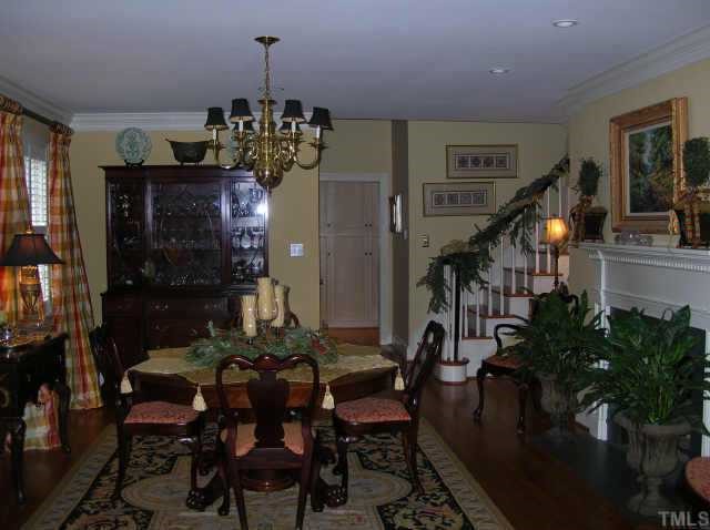 2818 Exeter Circle Raleigh, NC 27608 - Photo 2 of 10 a view of a dining room with furniture and chandelier