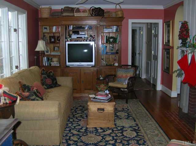 2818 Exeter Circle Raleigh, NC 27608 - Photo 3 of 10 a living room with furniture and a flat screen tv