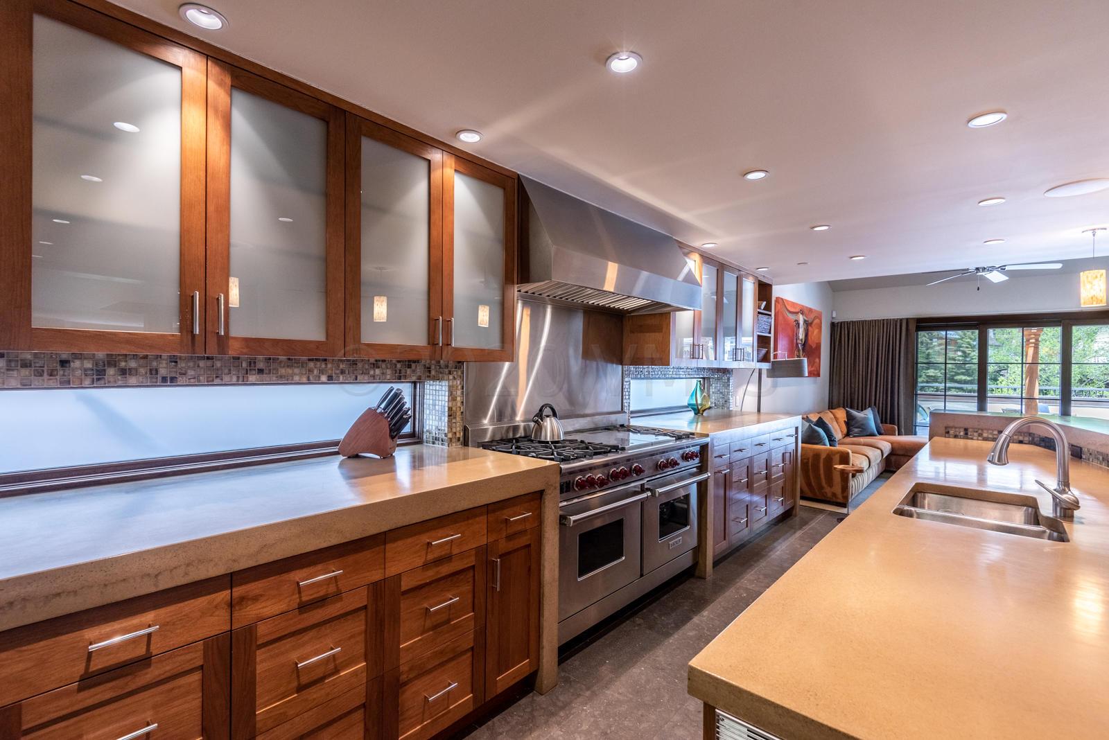 201 Gore Creek Drive, Unit R1 Vail, CO 81657 - Photo 12 of 42 a kitchen with stainless steel appliances a stove sink and cabinets