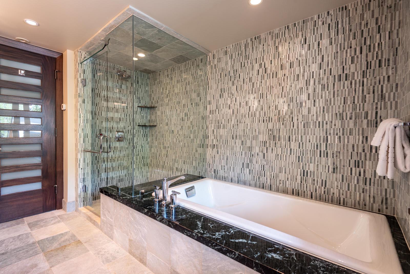 201 Gore Creek Drive, Unit R1 Vail, CO 81657 - Photo 37 of 42 a bathroom with a bathtub and shower