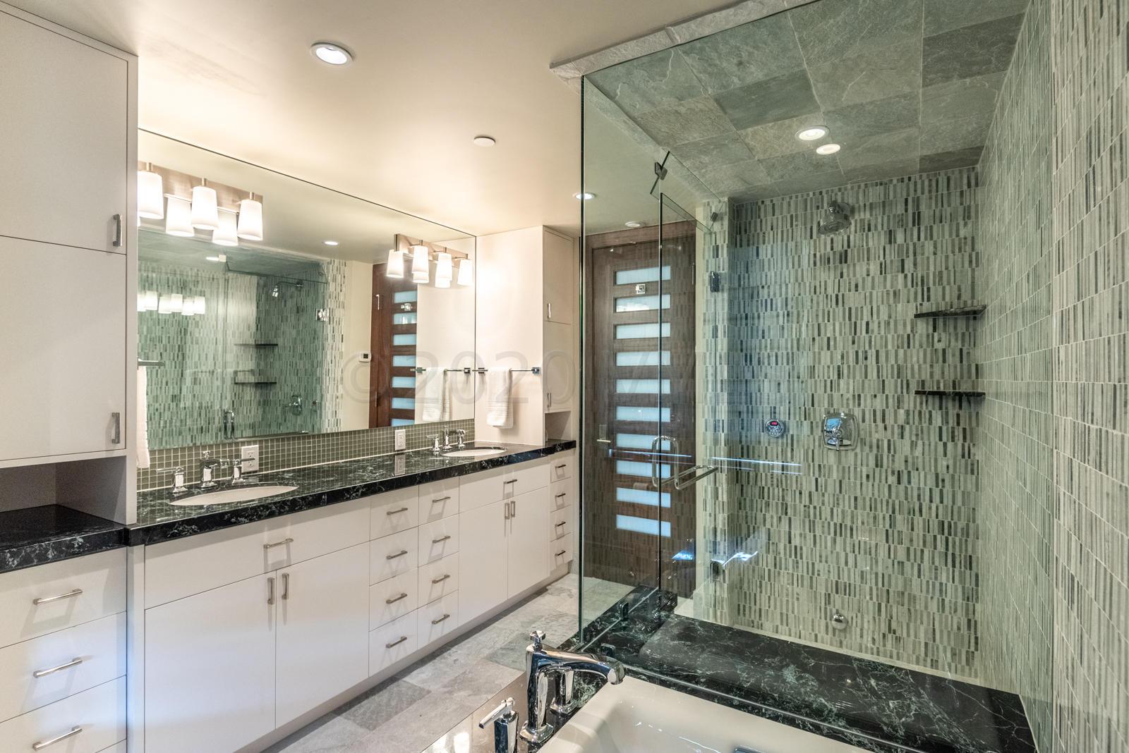 201 Gore Creek Drive, Unit R1 Vail, CO 81657 - Photo 39 of 42 a bathroom with a shower sink and mirror