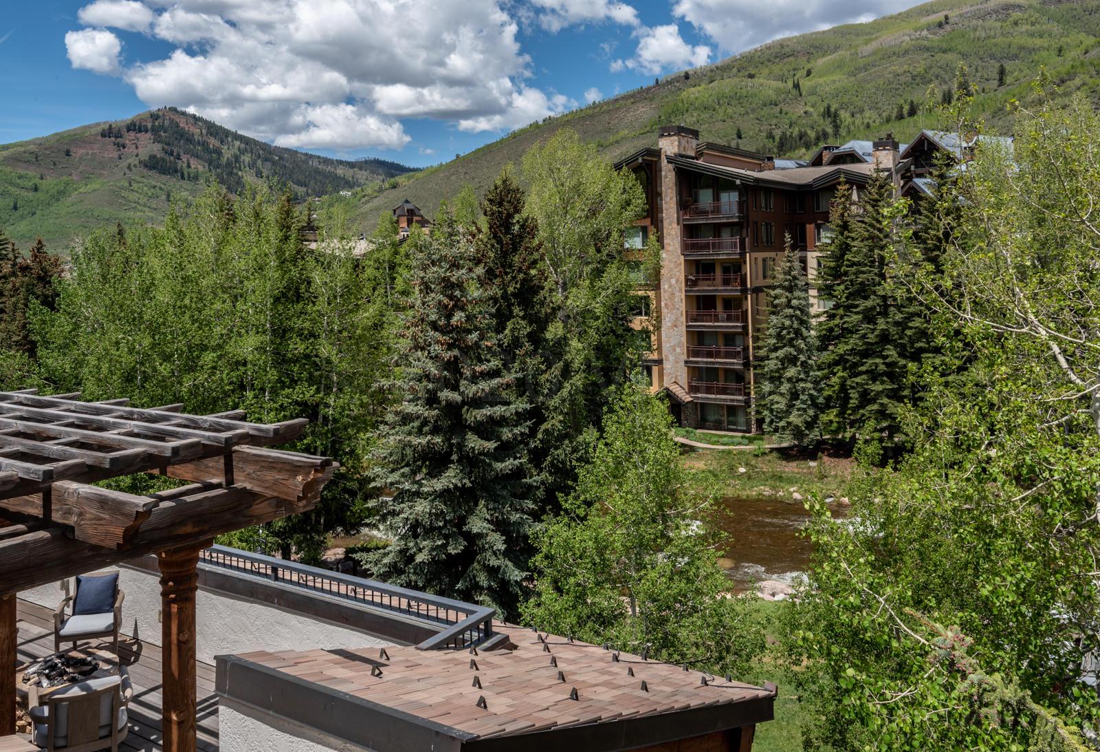 201 Gore Creek Drive, Unit R1 Vail, CO 81657 - Photo 40 of 42 a view of a backyard with plants