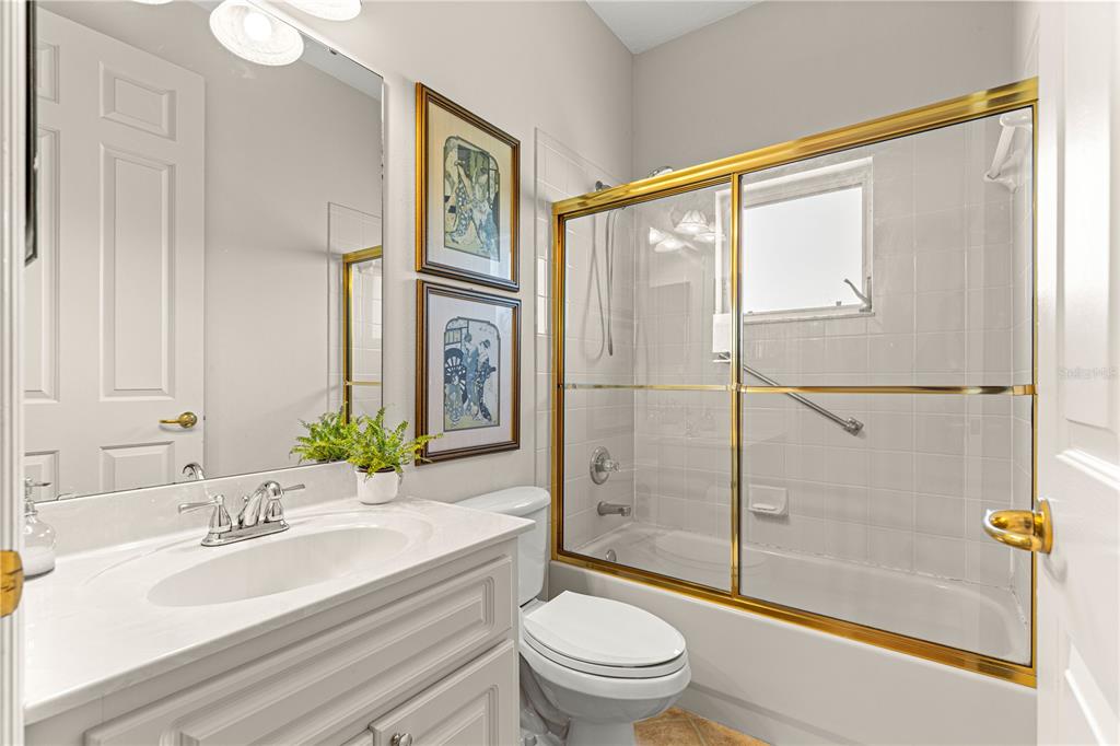 9110 Southwest 96th Court Road Ocala, FL 34481 - Photo 19 of 45 a bathroom with a sink a toilet and shower