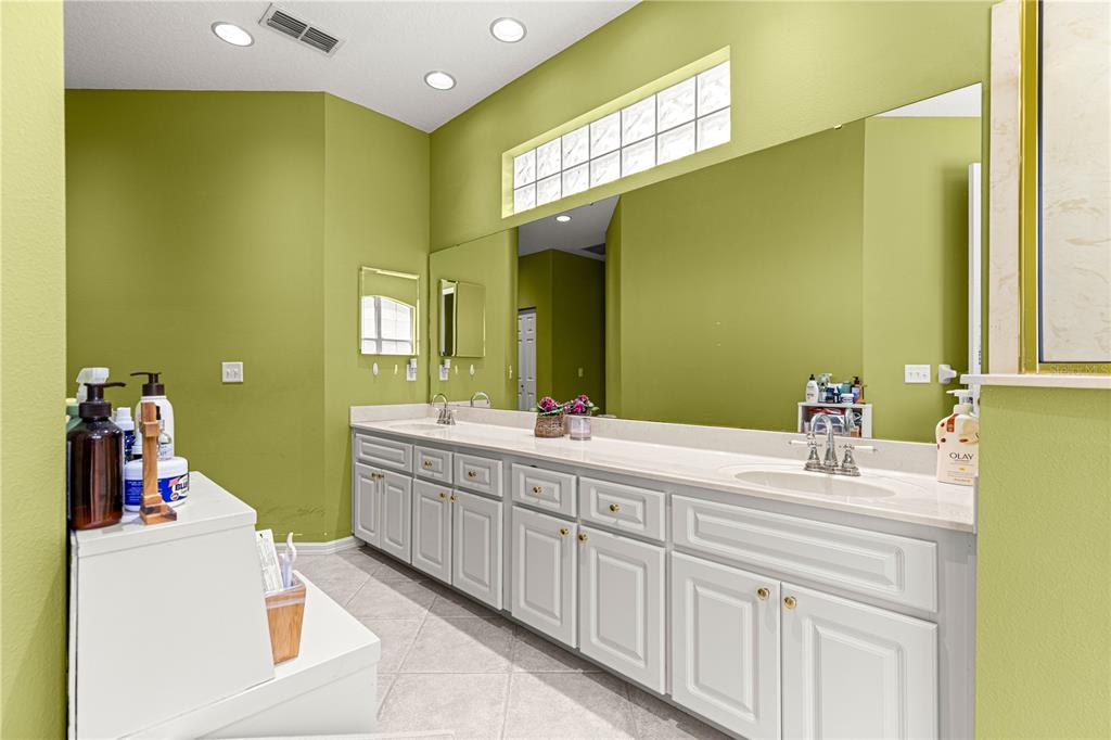 9110 Southwest 96th Court Road Ocala, FL 34481 - Photo 25 of 45 a bathroom with a sink and a mirror