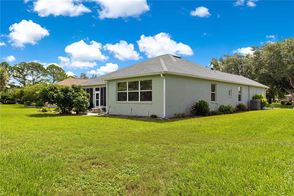 9110 Southwest 96th Court Road Ocala, FL 34481 - Photo 30 of 45 a view of an house with backyard space and garden
