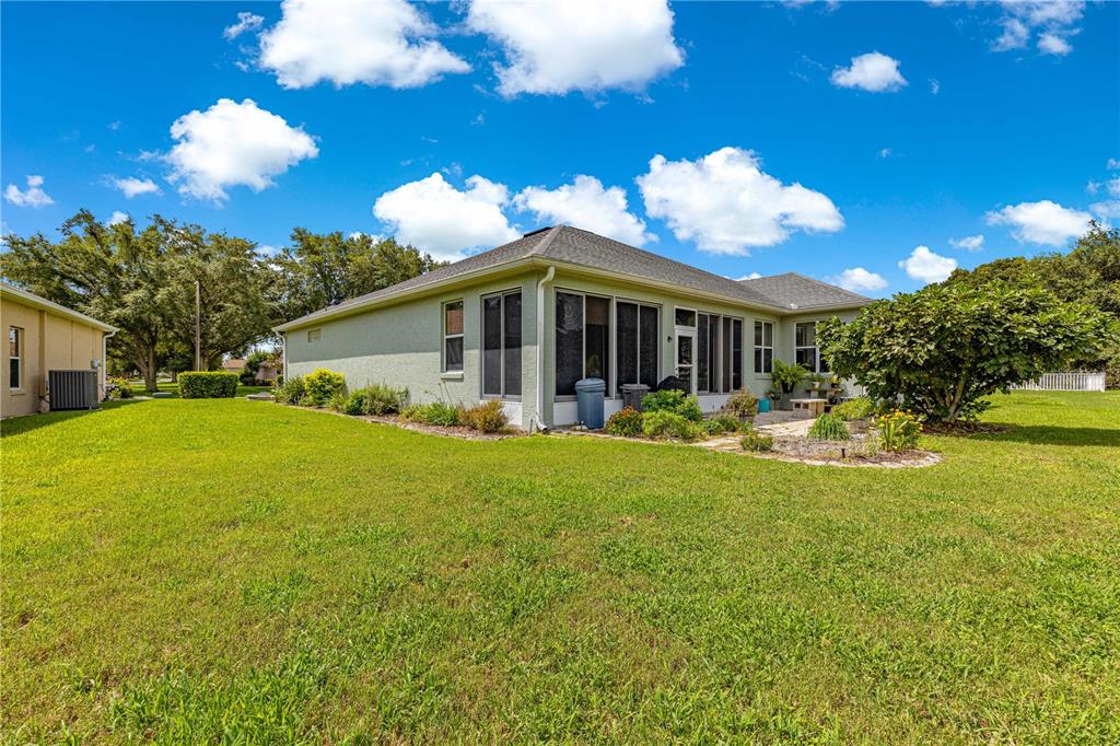 9110 Southwest 96th Court Road Ocala, FL 34481 - Photo 34 of 45 a view of a patio with table and chairs and potted plants