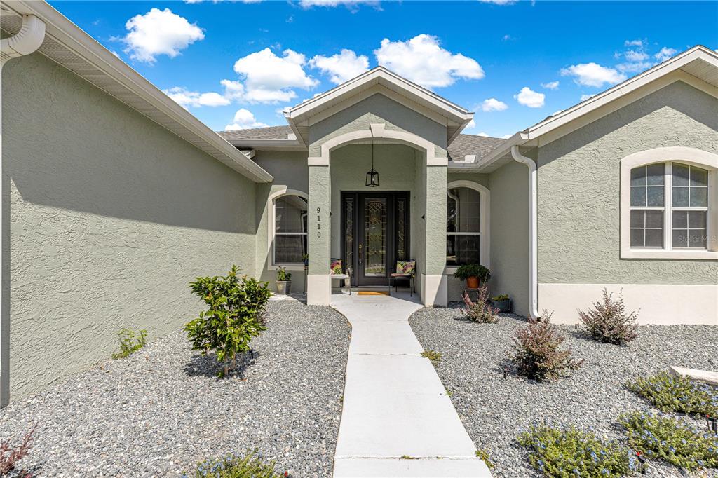 9110 Southwest 96th Court Road Ocala, FL 34481 - Photo 36 of 45 a view of a house with potted plants