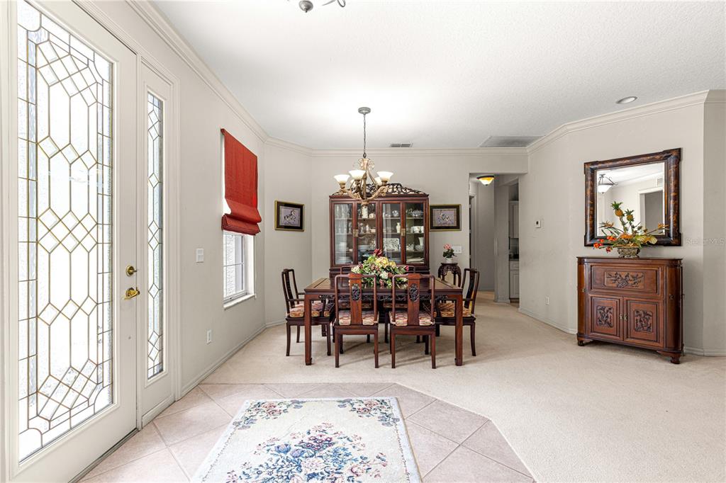 9110 Southwest 96th Court Road Ocala, FL 34481 - Photo 37 of 45 a view of a dining room and livingroom with furniture window and wooden floor
