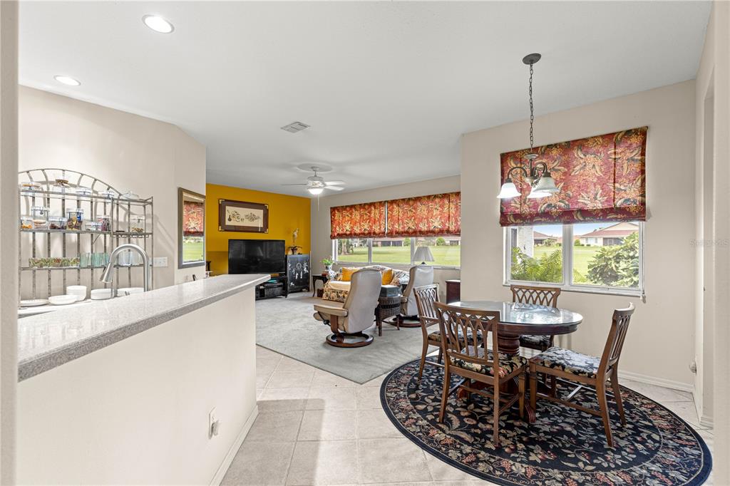 9110 Southwest 96th Court Road Ocala, FL 34481 - Photo 7 of 45 a living room with furniture two window and a dining table