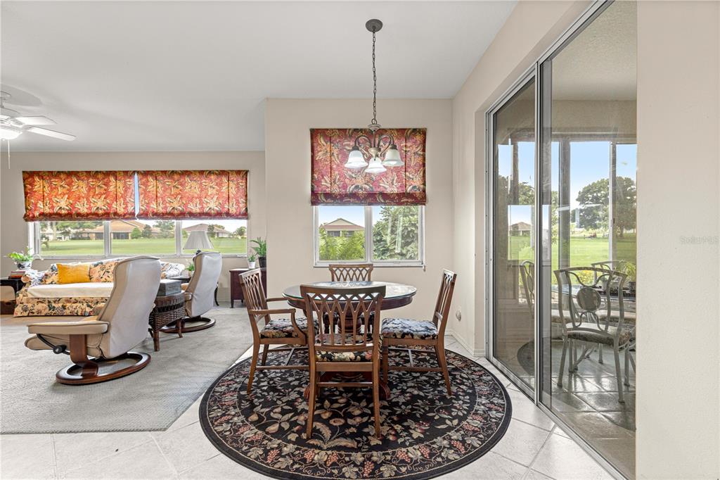 9110 Southwest 96th Court Road Ocala, FL 34481 - Photo 8 of 45 a view of a dining room with furniture window and outside view