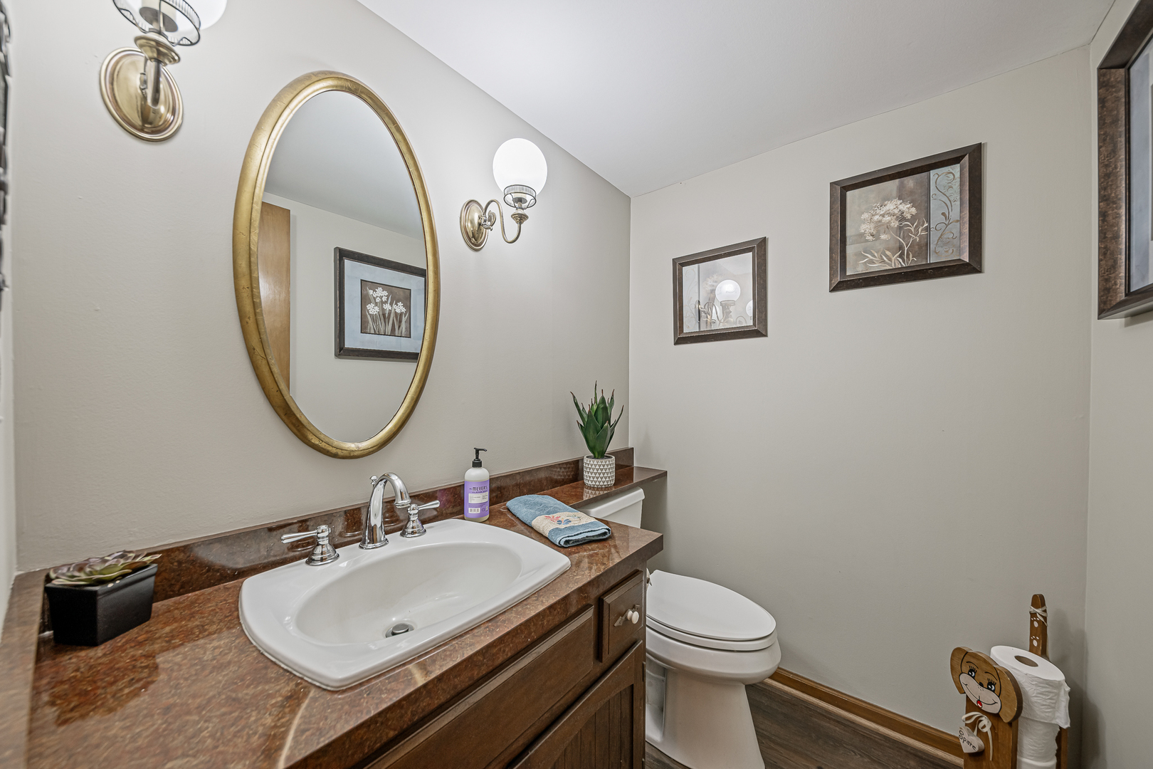 20735 Wolf Road Mokena, IL 60448 - Photo 17 of 22 a bathroom with a toilet a sink and a mirror
