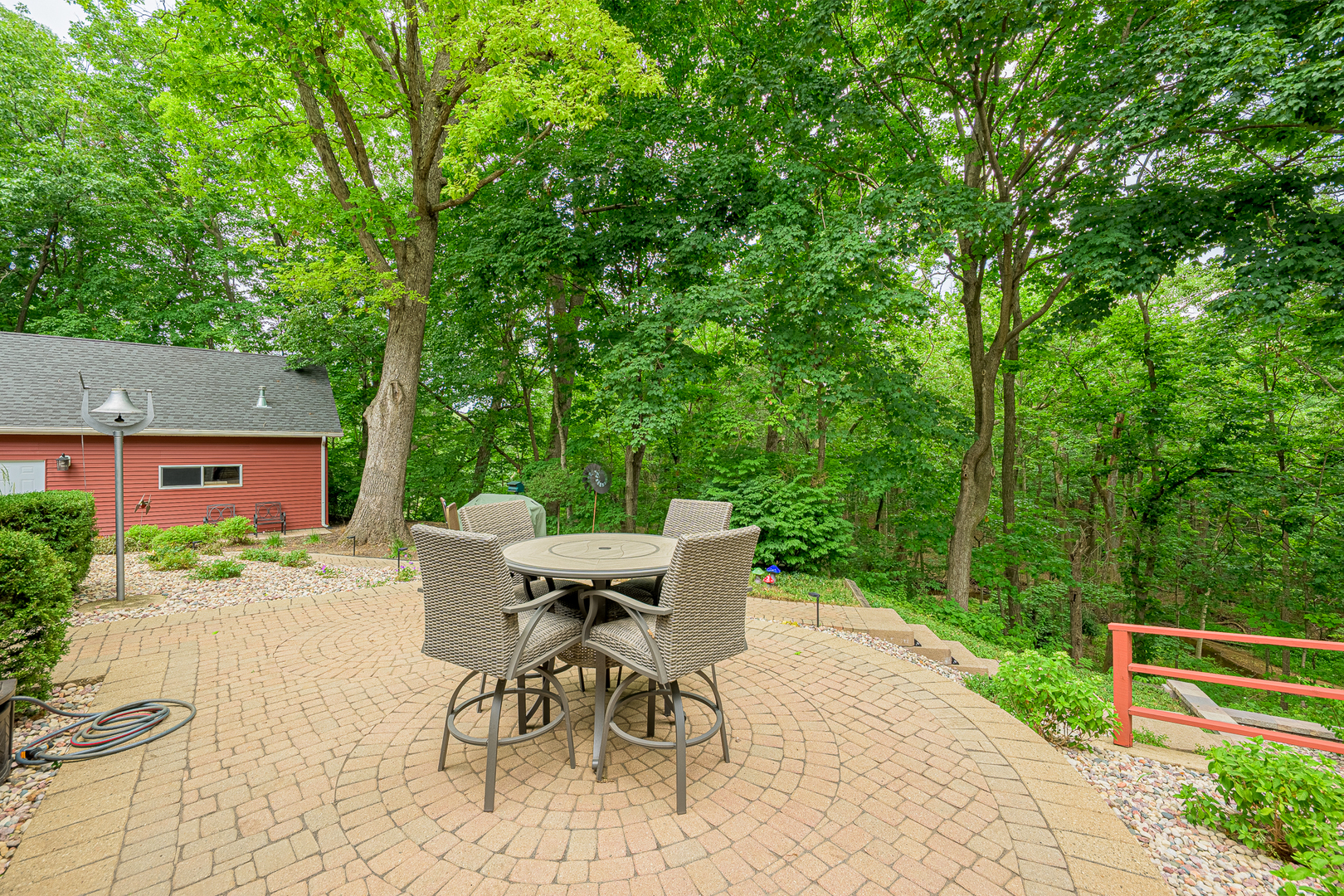 20735 Wolf Road Mokena, IL 60448 - Photo 19 of 22 a view of a patio with table and chairs and potted plants