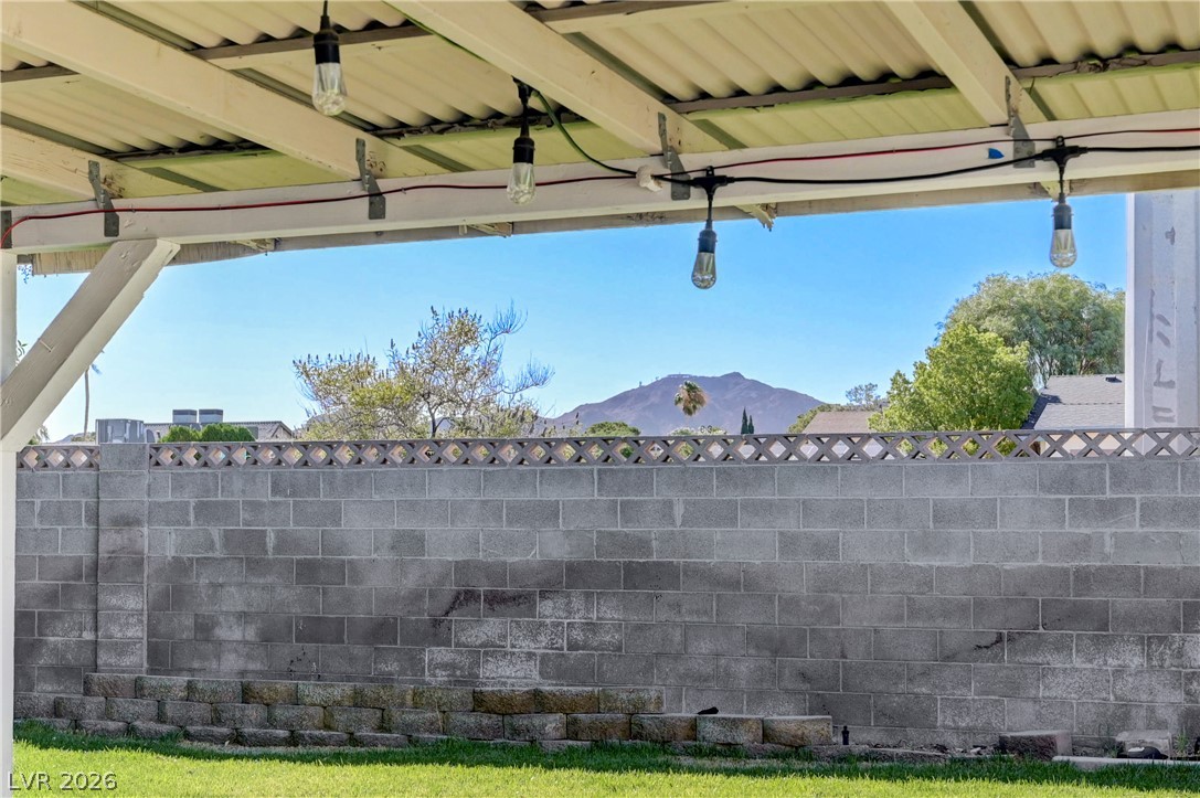 1331 Pinto Road Boulder City, NV 89005 - Photo 34 of 46 A private yard offers clear mountain views and a solid block fence.