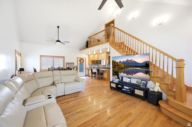 169 Taylor Road, Unit 101 Grantsville, UT 84029 - Photo 9 of 47 Main home - Vaulted ceiling living area with wood-finish flooring