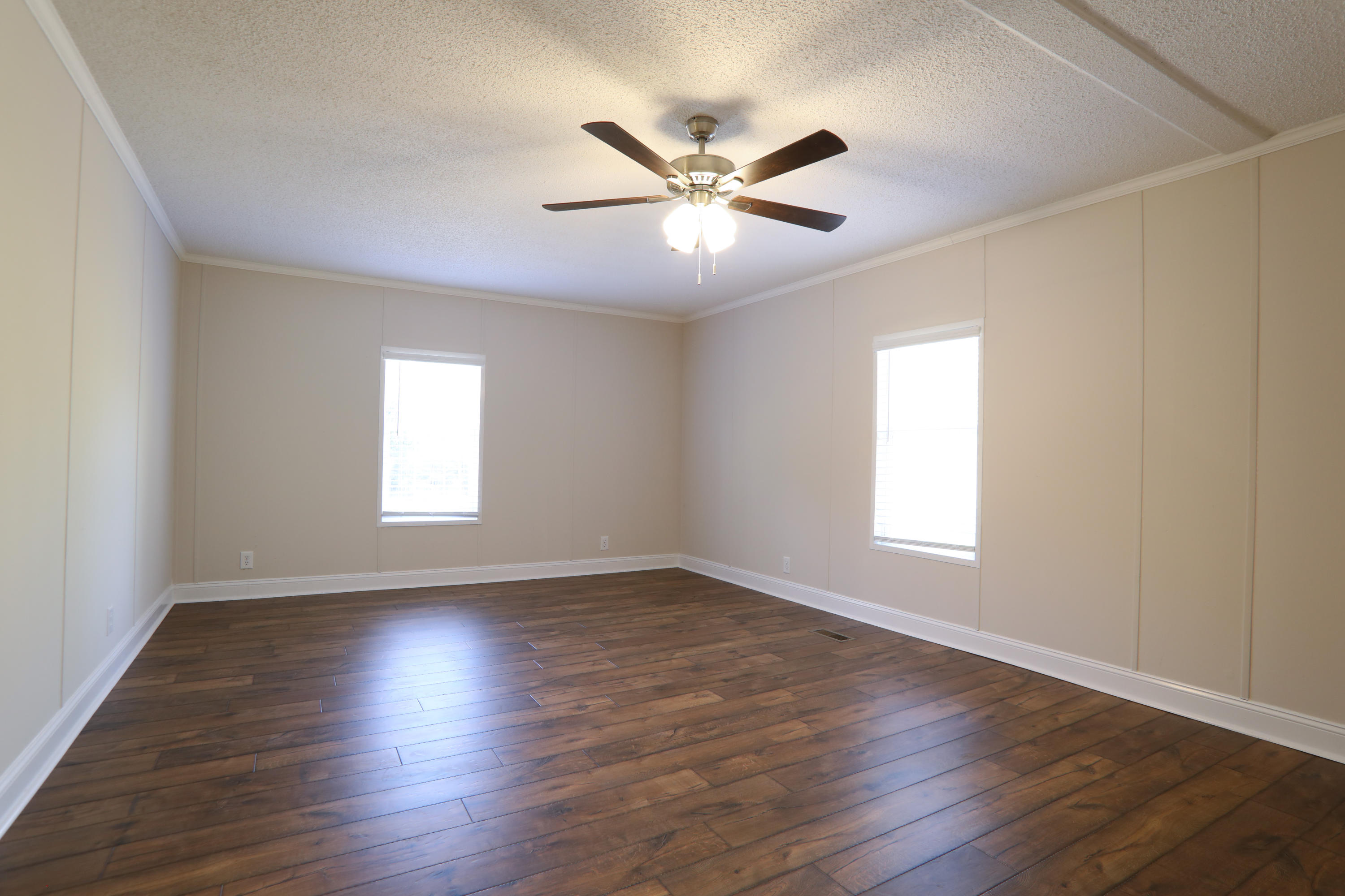 2080 West Kelley Road Baker, FL 32531 - Photo 11 of 20 a view of an empty room with wooden floor and a window