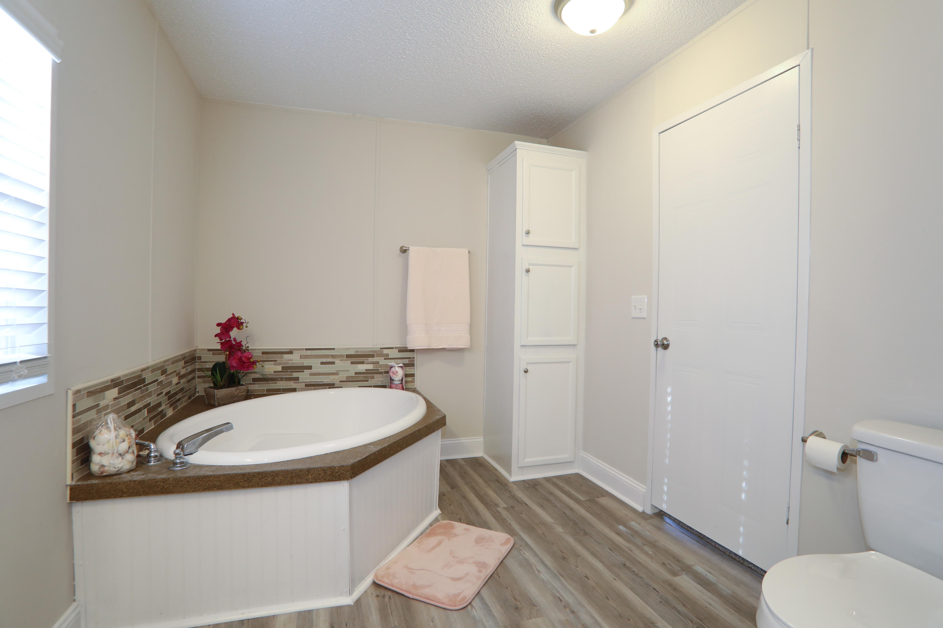2080 West Kelley Road Baker, FL 32531 - Photo 13 of 20 a bathroom with a sink and a mirror