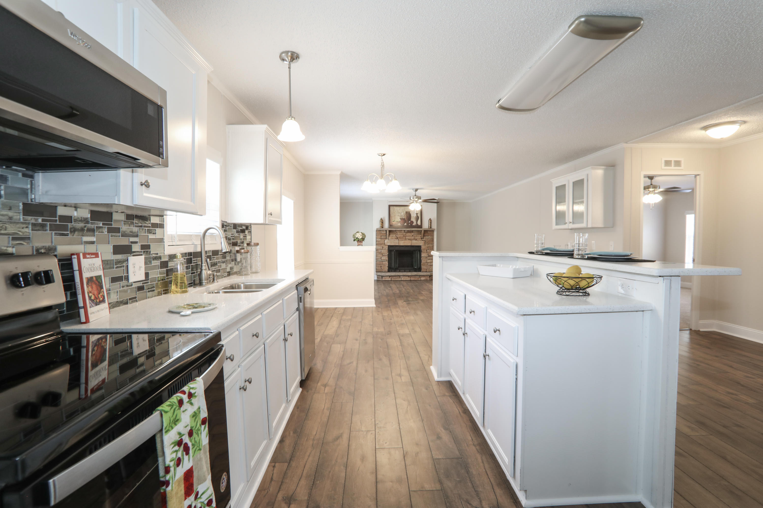 2080 West Kelley Road Baker, FL 32531 - Photo 4 of 20 a large kitchen with a stove and a sink