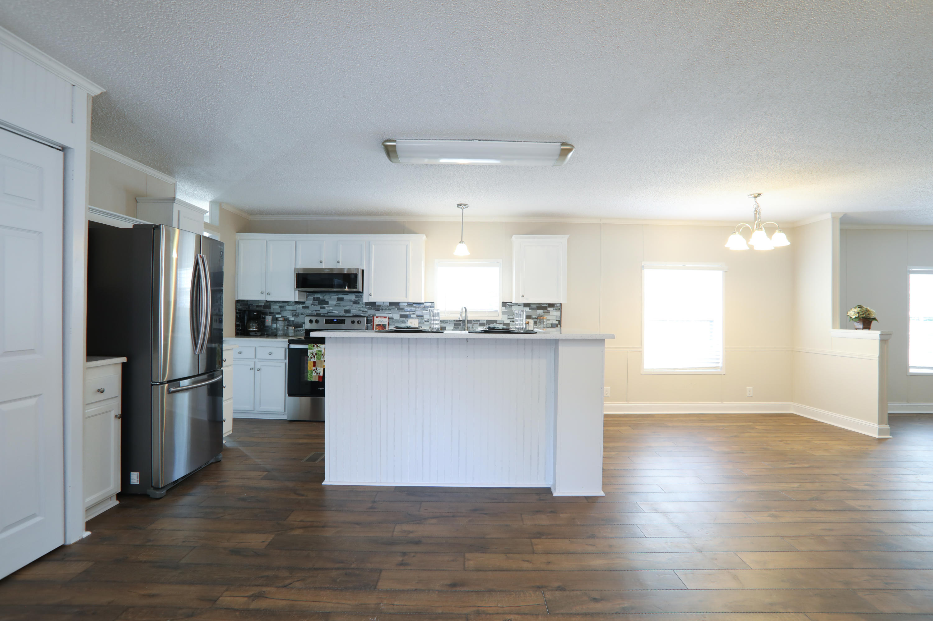 2080 West Kelley Road Baker, FL 32531 - Photo 5 of 20 a view of kitchen with refrigerator stove microwave and cabinets