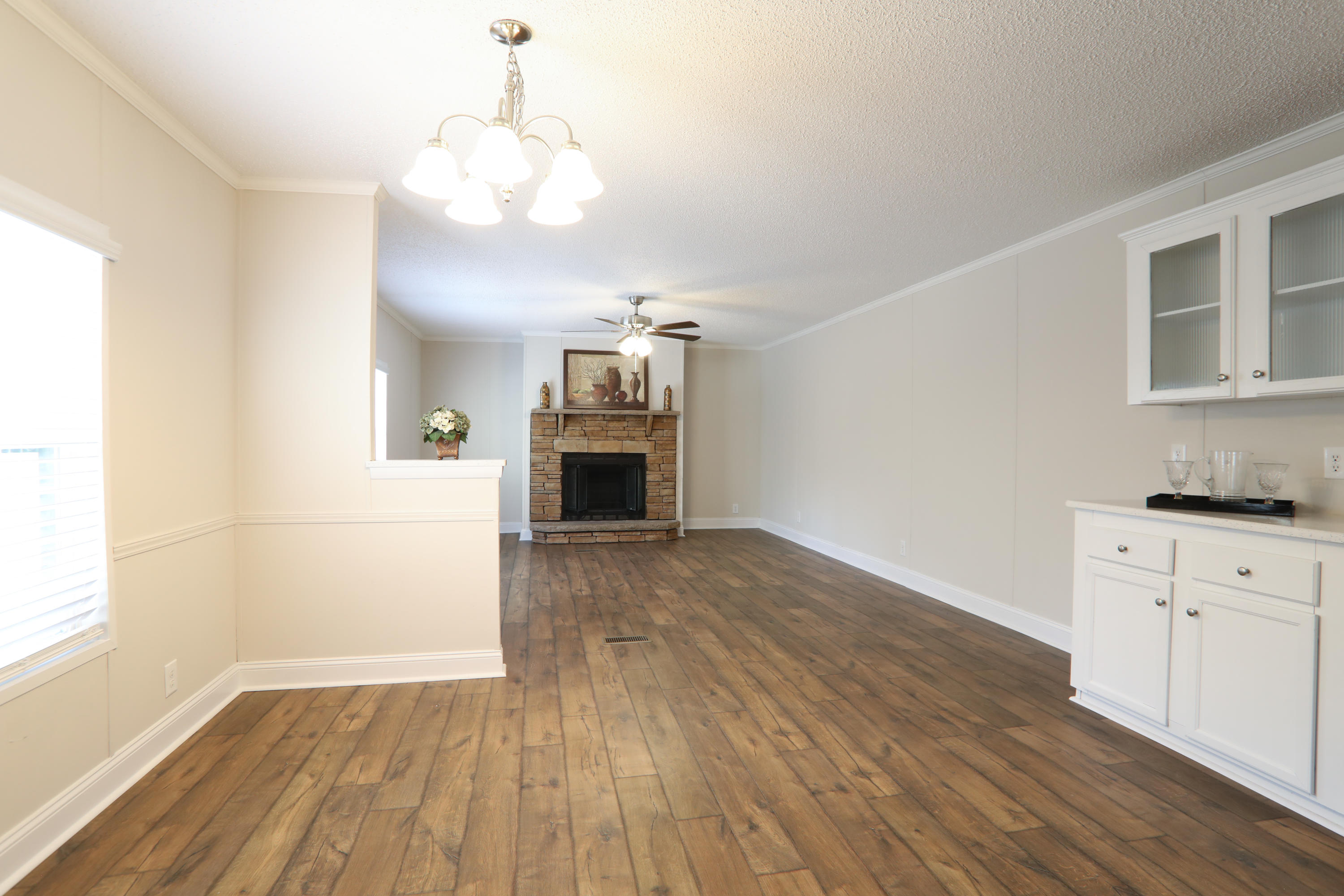 2080 West Kelley Road Baker, FL 32531 - Photo 6 of 20 a view of a kitchen with wooden floor and a kitchen