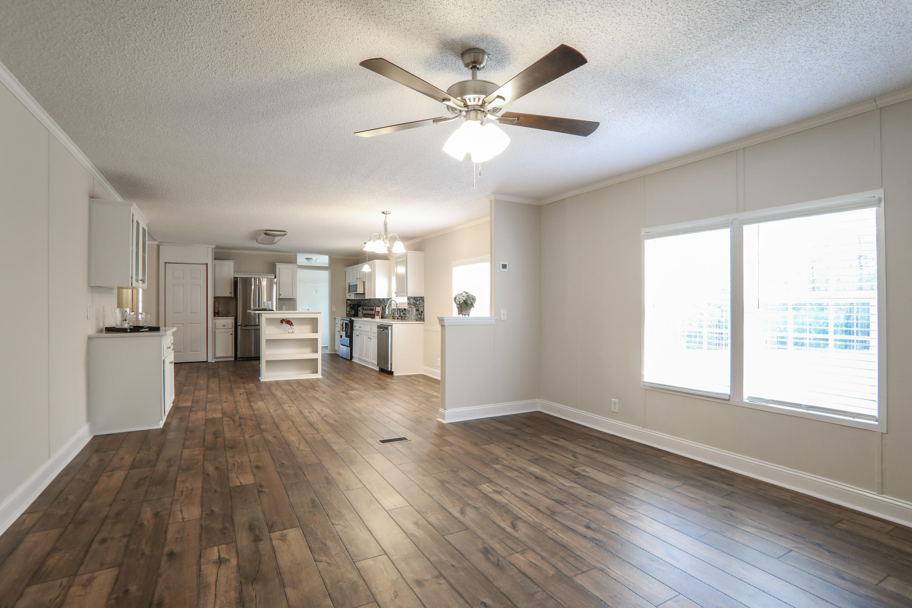 2080 West Kelley Road Baker, FL 32531 - Photo 8 of 20 a view of an empty room with wooden floor and a window