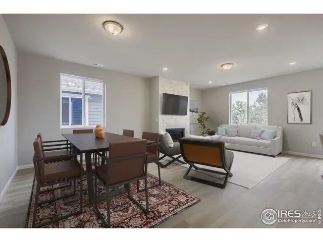a living room with furniture a window and a table