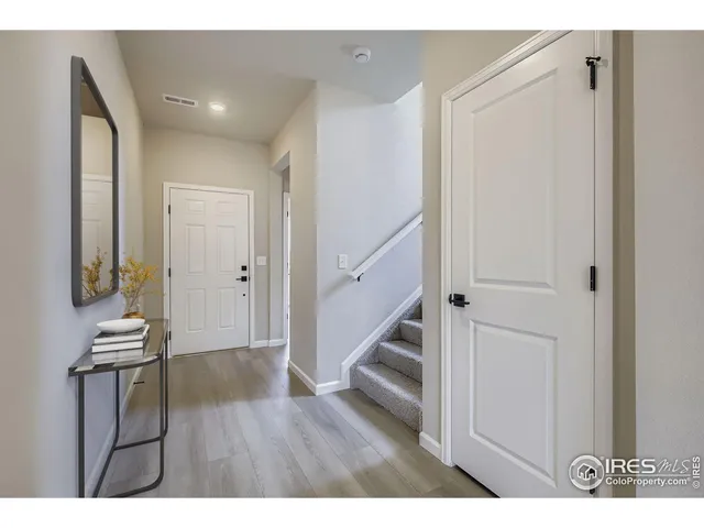 a view of entryway with wooden floor
