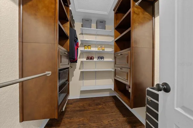 a spacious bathroom with a bathtub sink and mirror