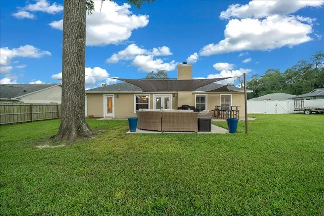 an aerial view of a house with outdoor space