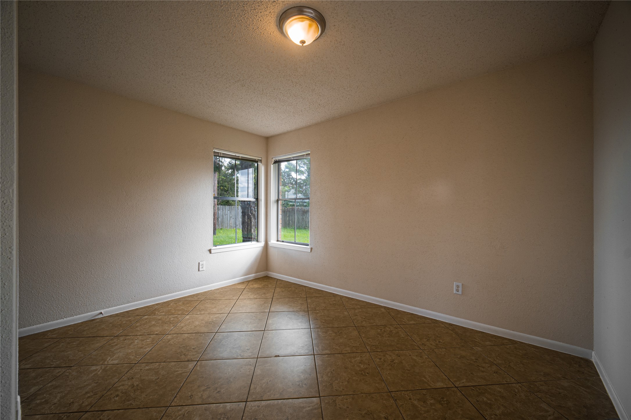 13314 Sablewood Lane Houston, TX 77014 - Photo 4 of 12 a view of an empty room with a window
