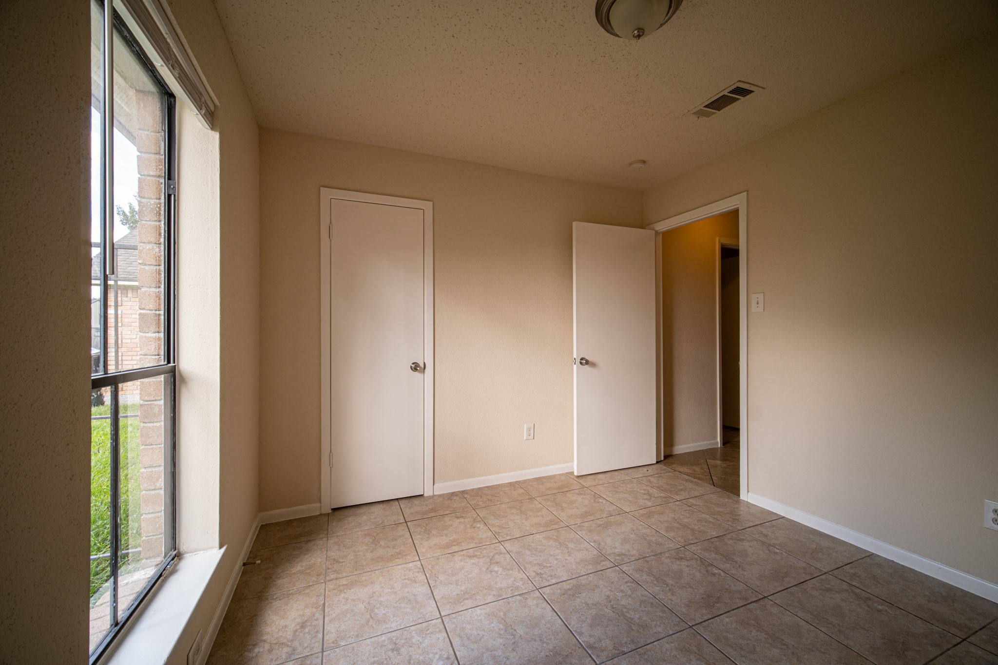 13314 Sablewood Lane Houston, TX 77014 - Photo 7 of 12 a view of an empty room with a window