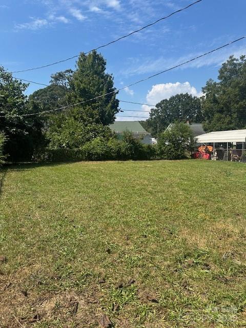 407 Florence Street Clinton, SC 29325 - Photo 3 of 3 a view of a field with an outdoor space