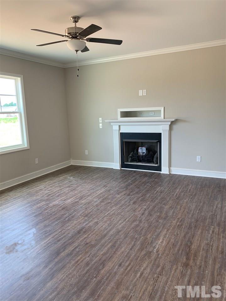 9750 Chapman Road Bailey, NC 27807 - Photo 5 of 13 Fireplace. LVP Flooring