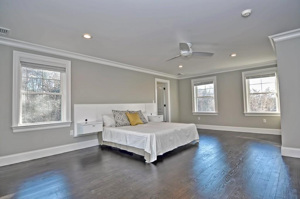 50 Beatrice Way Canton, MA 02021 - Photo 15 of 29 a bedroom with a bed lamp closet and window