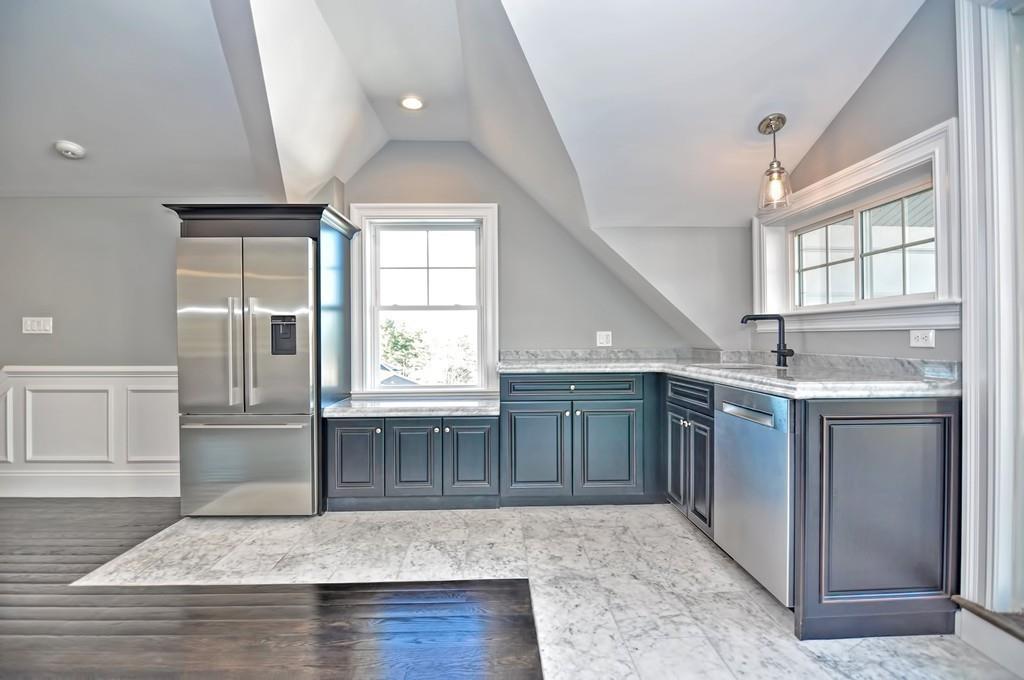 50 Beatrice Way Canton, MA 02021 - Photo 17 of 29 an open kitchen with granite countertop cabinets stainless steel appliances and a window