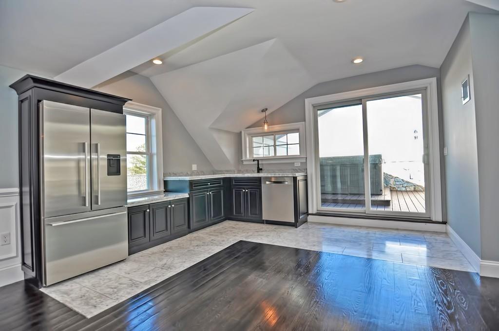 50 Beatrice Way Canton, MA 02021 - Photo 18 of 29 an empty room with wooden floor and windows