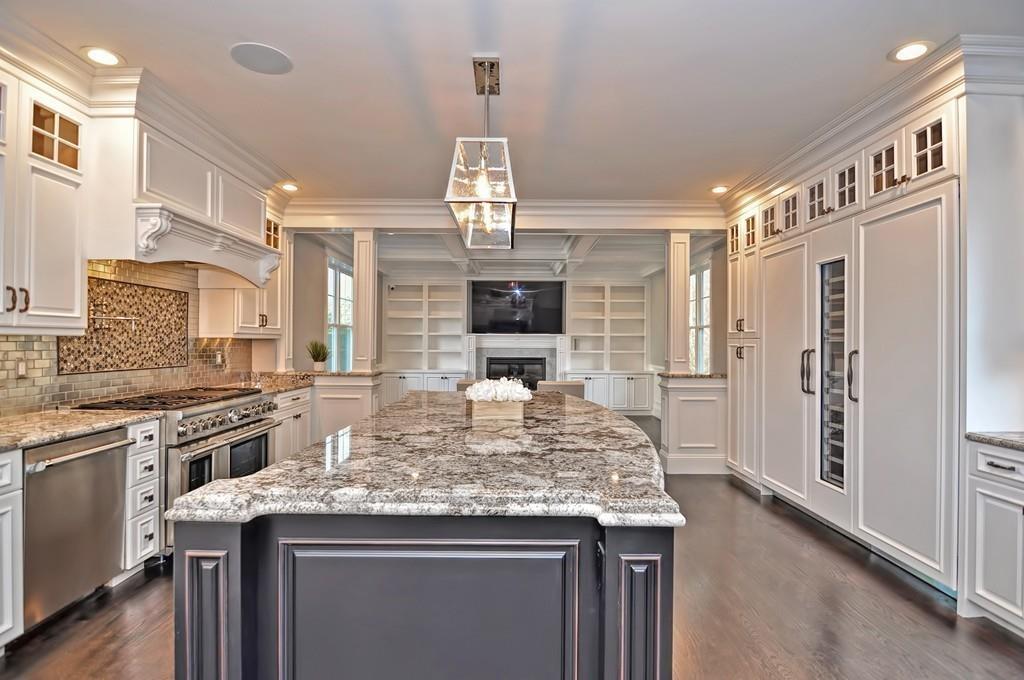 50 Beatrice Way Canton, MA 02021 - Photo 2 of 29 a kitchen with kitchen island granite countertop a stove and a refrigerator