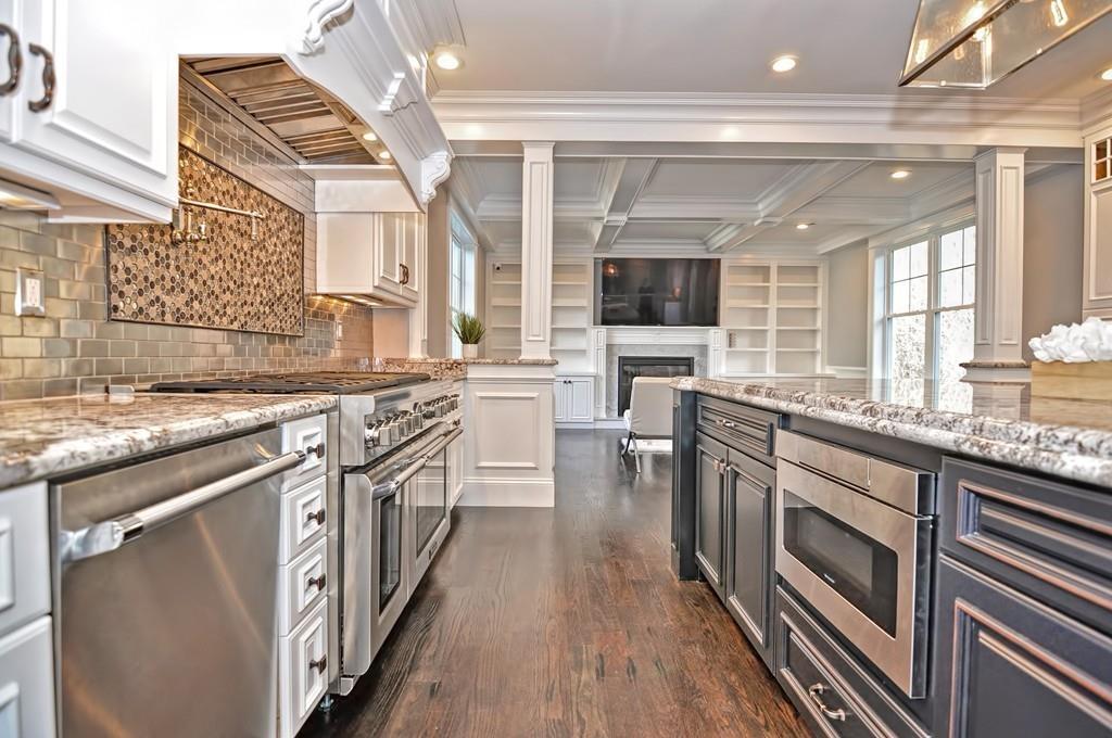 50 Beatrice Way Canton, MA 02021 - Photo 3 of 29 a kitchen with stainless steel appliances granite countertop a sink and stove top oven